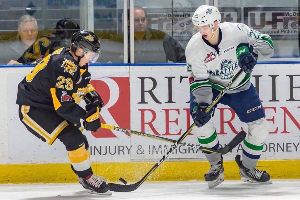The Thunderbirds’ Samuel Huo, right, advances the puck against the Wheat Kings. COURTESY PHOTO, Brian Liesse, T-Birds