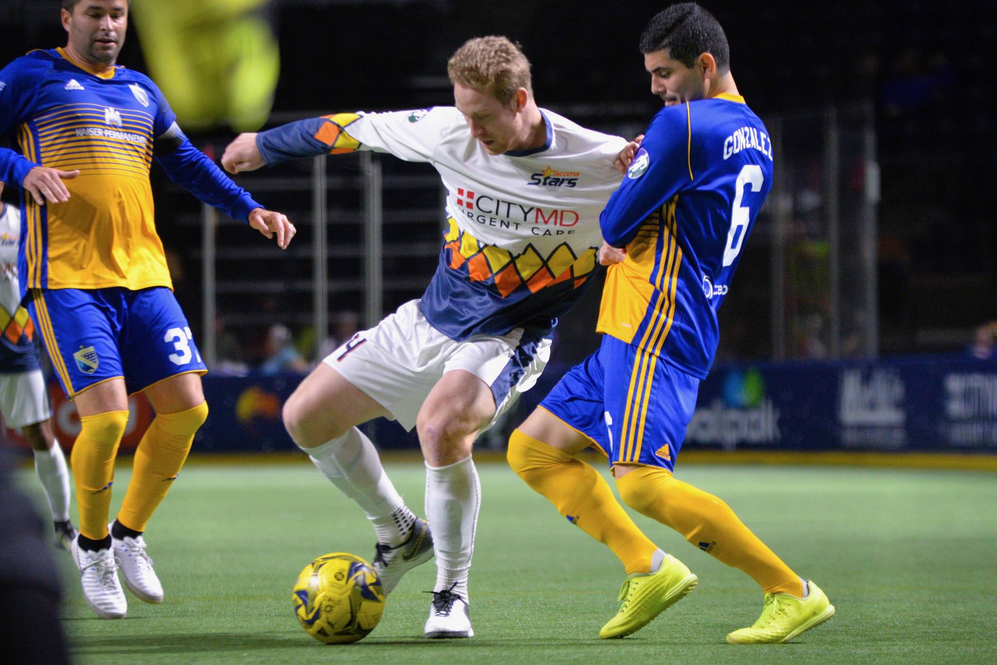The Stars’ Vince McCluskey battles the Sockers’ Felipe Gonzalez as he pushes the ball up the pitch during MASL play Friday night at the accesso ShoWare Center. COURTESY PHOTO, Stars