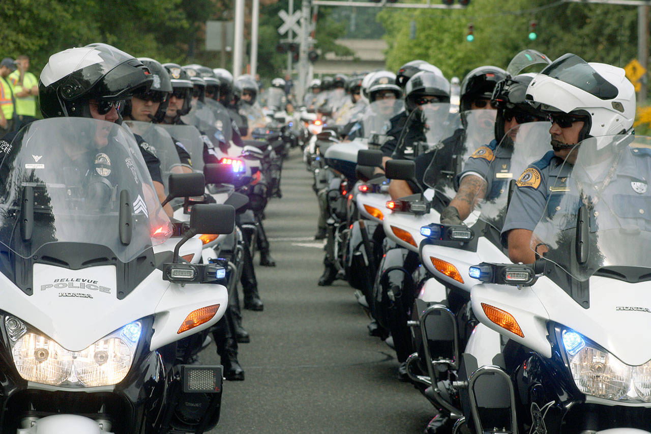 Motorcycle officers gather outside of the accesso ShoWare Center on July 31 prior to the memorial service for Kent Police Officer Diego Moreno. FILE PHOTO