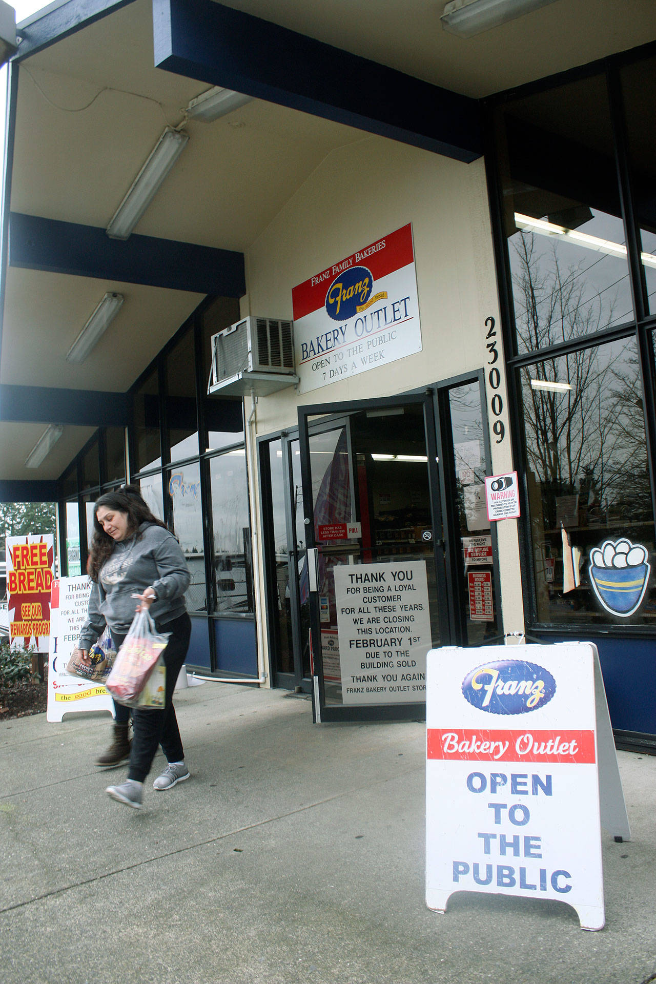 A customer leaves with items Thursday from the Franz Bakery Outlet, 23009 Military Road S., in Kent that will close Feb. 1 after more than 30 years in town. Poulsbo RV, next door to the outlet, brought the property in an effort to stay at the site despite plans by the state Department of Transportation to extend Veterans Drive underneath Interstate 5 as part of the Puget Sound Gateway State Route 509 project. MARK KLAAS, Kent Reporter