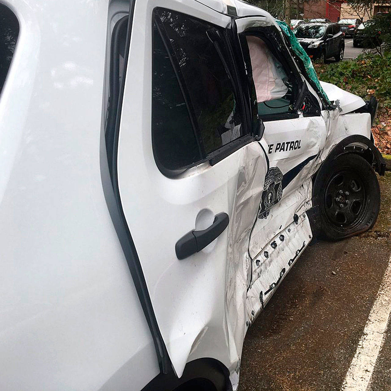 A State Patrol SUV back at patrol offices after a trooper suffered minor injuries in a collision Wednesday morning in Kent at the intersection of Washington Avenue South and State Route 516, aka Willis Street. COURTESY PHOTO, State Patrol