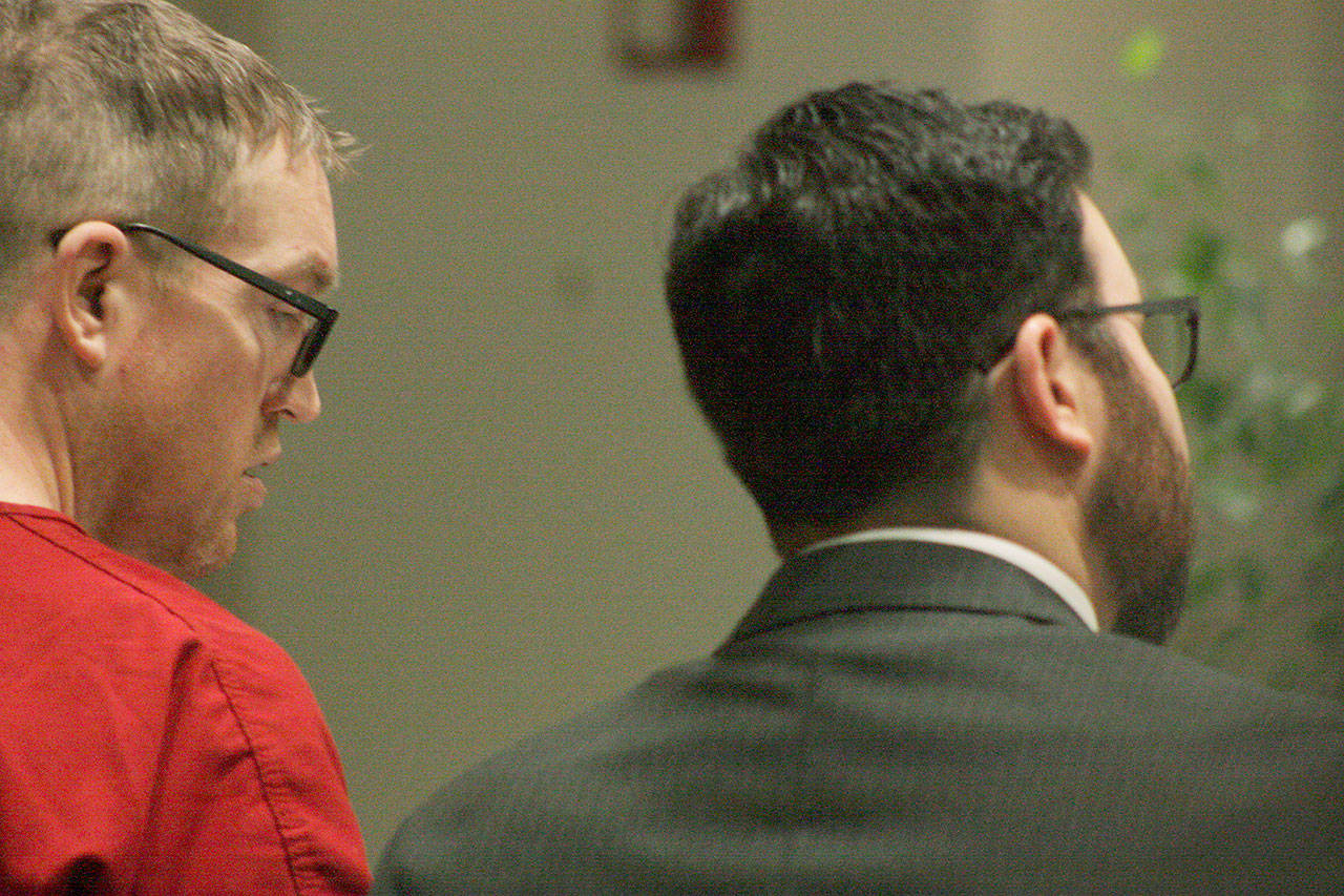 Nicholas Slater, left, listens in as his attorney, Deputy Public Defender Michael Schueler, talks to King County Superior Court Judge Karen Donohue during Slater’s arraignment Monday in Kent. Slater pleaded not guilty to vehicular homicide. MARK KLAAS, Kent Reporter