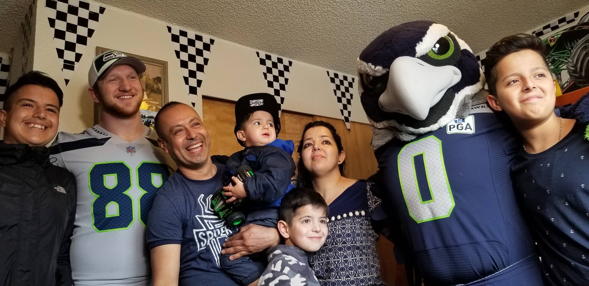 Seahawks tight end Will Dissly and Blitz made a surprise visit to the Magana family at their Kent apartment Thursday for a bedroom makeover reveal with five of their young sons. The shared bedroom received a new Monster Jam-themed look, complete with bedding, décor and toys. COURTESY PHOTO