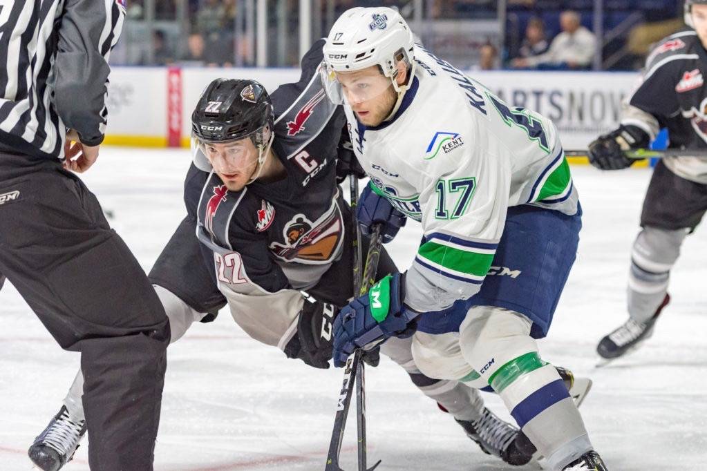 The Thunderbirds’ Jaxan Kaluski and the Giants’ Jared Dmytriw tangle for the puck during WHL play last Tuesday. Vancouver prevailed on Kent ice, 5-1. COURTESY PHOTO, Brian Liesse, T-Birds