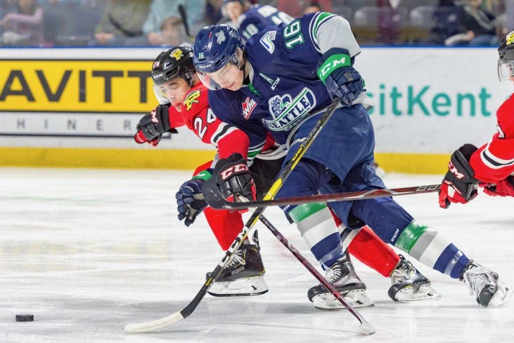 The Thunderbirds’ Noah Philp, right, drives the puck up the ice with the Winterhawks’ Seth Jarvis defending during their WHL game at the accesso ShoWare Center on Saturday night. COURTESY PHOTO, Brian Liesse, T-Birds
