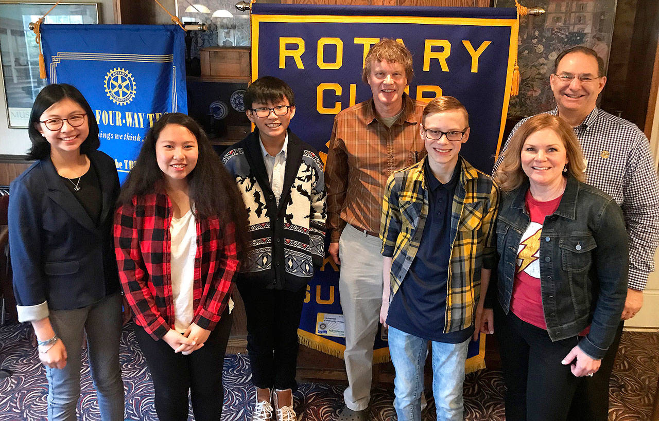 The Kent Sunrise Rotary Club recently recognized Meridian Middle School students and staff, including, from left to right: Nicole Setiawan, Yolanda Le, Damon Chan, Paul Heath, Shae Ferguson and Michele Tang. Dave Mitchell, Kent Sunrise Rotarian, is on the far right. COURTESY PHOTO, Rotary