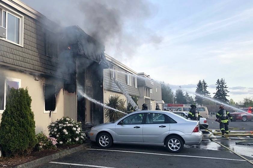 Crews douse an apartment units fire Sunday. No one was hurt in the fire. COURTESY PHOTO, Puget Sound RFA