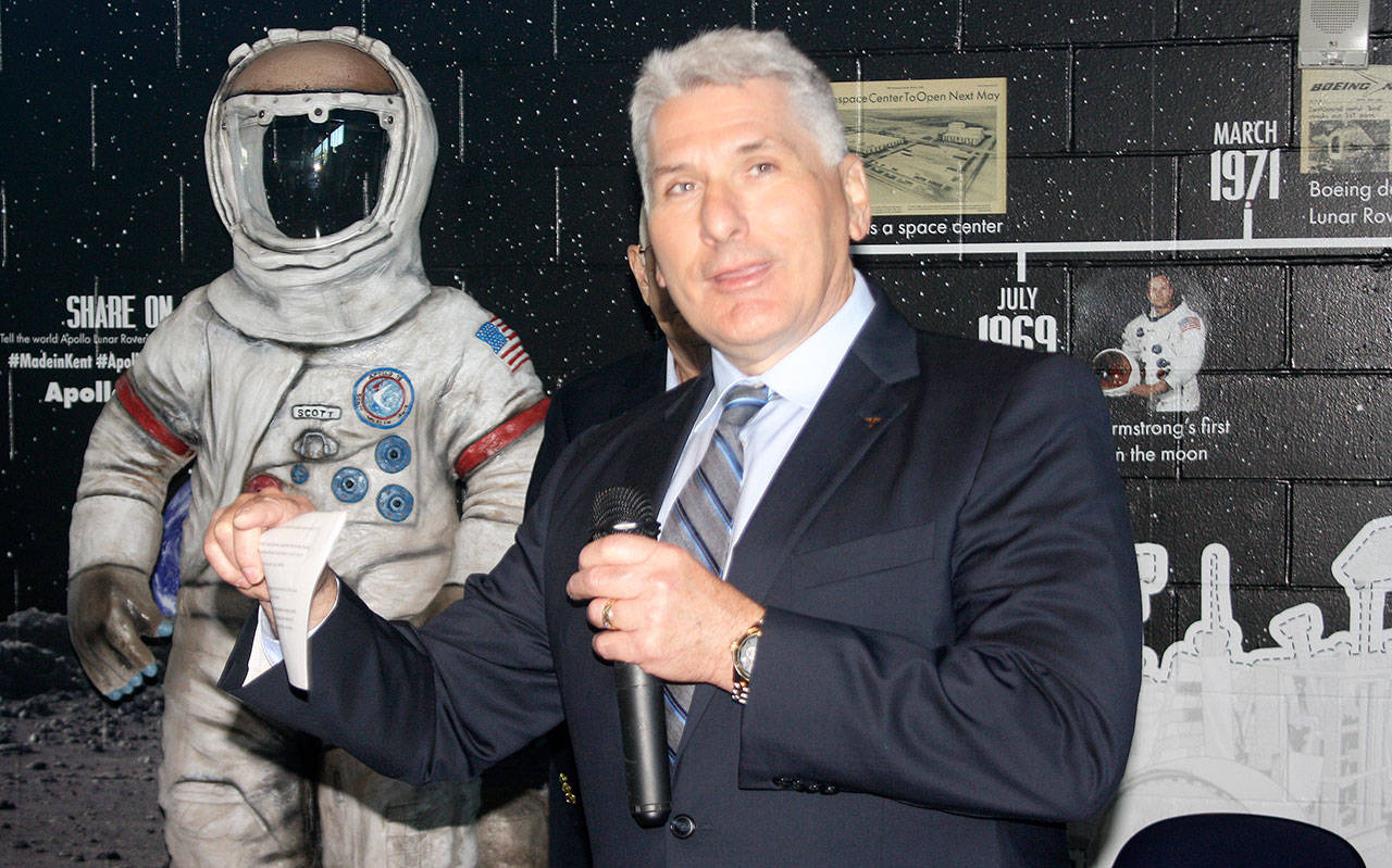Boeing historian Michael Lombardi helps unveil a new aerospace display at the accesso ShoWare Center to help raise funds for a lunar rover replica and interactive park in Kent. STEVE HUNTER, Kent Reporter