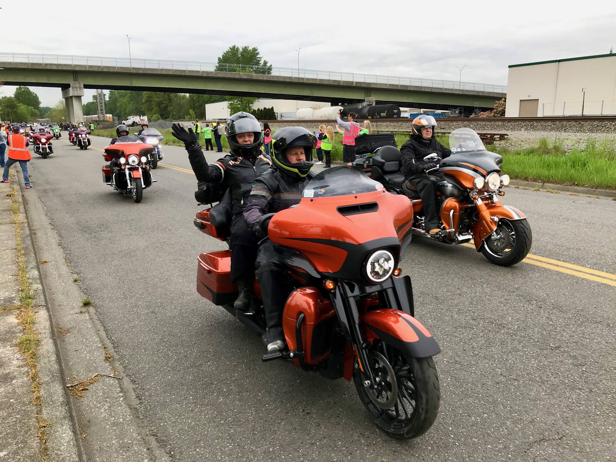 Harley-Davidson riders leave the Manheim Seattle Auto Auction parking lot in Kent on Friday, following 77th Avenue South out to the Valley Freeway. The field went eastbound on Highway 18 then eastbound on Interstates 90, 82 and 84 to Ontario, Ore., the first of nine stops on the Charity Ride Across America. MARK KLAAS, Kent Reporter