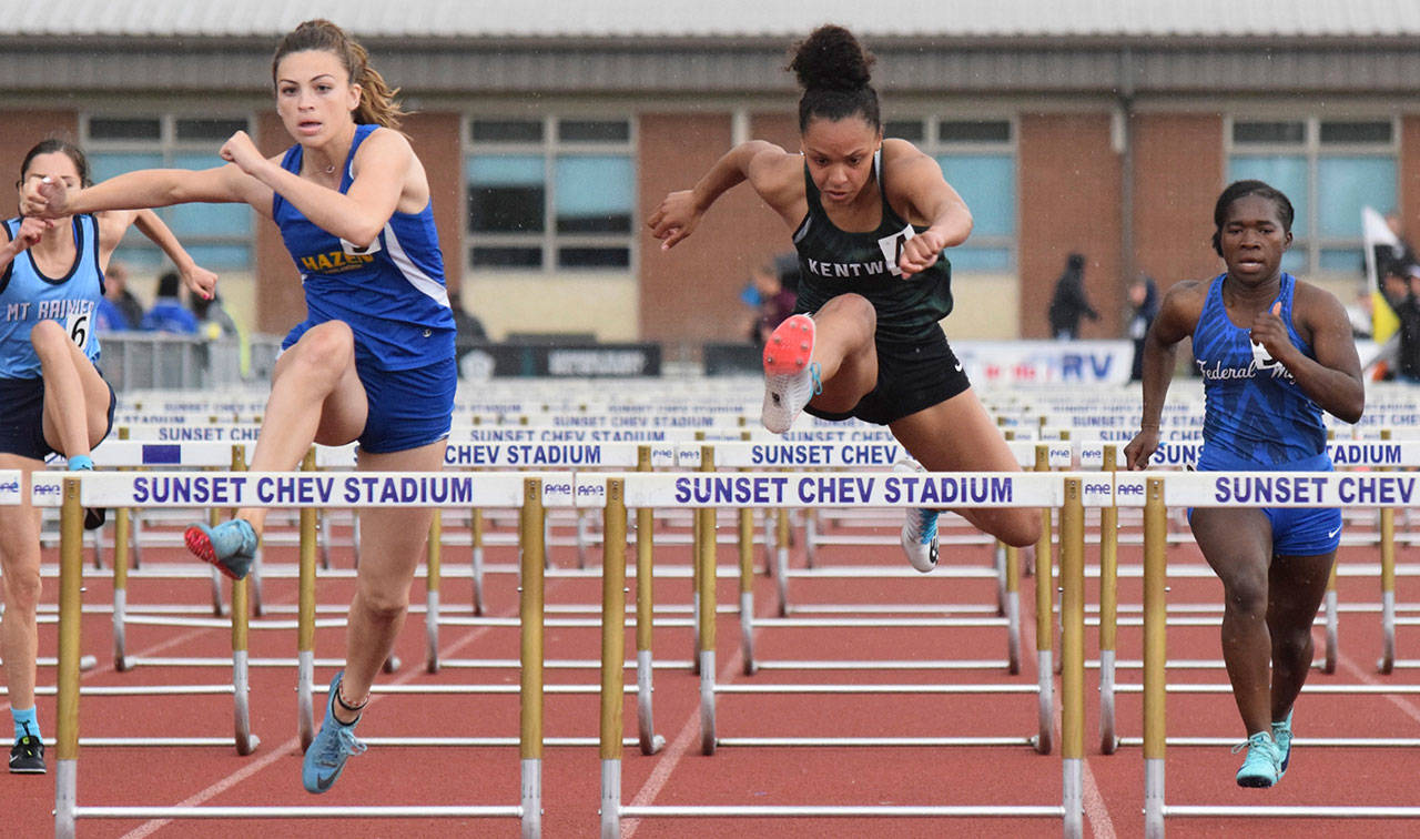 Kentwood’s state-bound Faith Marshall zips to first place in her 100-meter hurdles heat at the bi-district meet last week. Marshall had the third-best time at the meet, 14.89 seconds. RACHEL CIAMPI, Kent Reporter