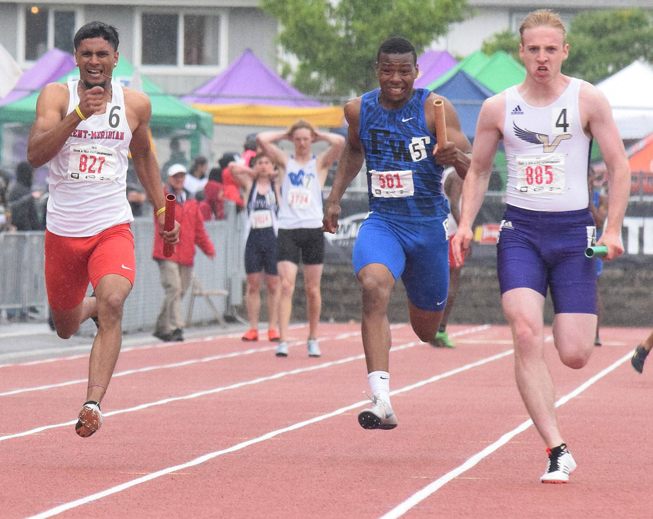 K.D. Dhillon, far left, anchors Kent-Meridian to a second-place finish in the 400-meter relay. RACHEL CIAMPI, Kent Reporter