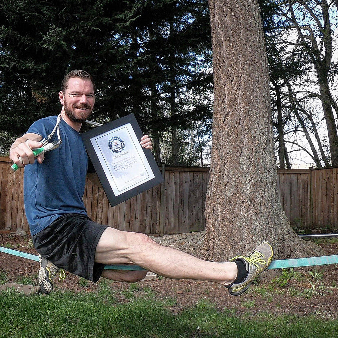 Maple Valley’s Justin Gielski holds his Guinness World Record certificate for doing the “most consecutive skips over a rope on a slack line,” a feat he says helped him earn a return appearance on NBC’s “American Ninja Warrior.” COURTESY PHOTO
