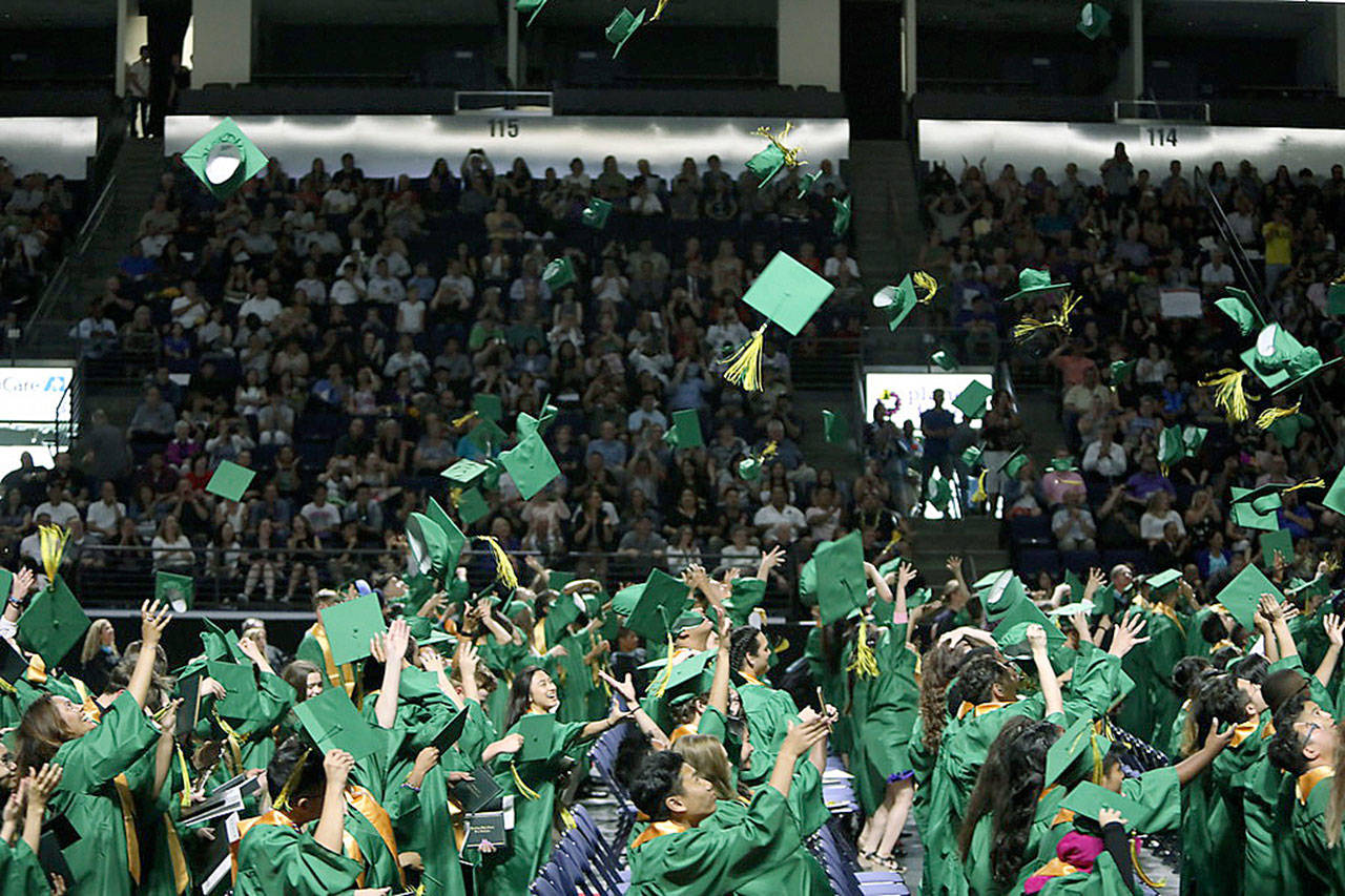 Graduating seniors from Kentridge High School’s class of ‘19 toss their caps into the air at the end of commencement at the accesso ShoWare Center last Saturday. Hundreds of seniors graduated from Kentridge, Kentlake, Kent-Meridian and Kentwood high schools last weekend. Parents, friends and other assorted loved ones showed up with flowers, balloons and congratulatory words and hugs. COURTESY PHOTO, Tracy Arnold