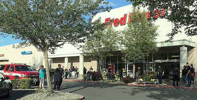 Fred Meyer customers and employees in Covington evacuate the store on June 8 after a small fire. COURTESY PHOTO, Puget Sound Fire