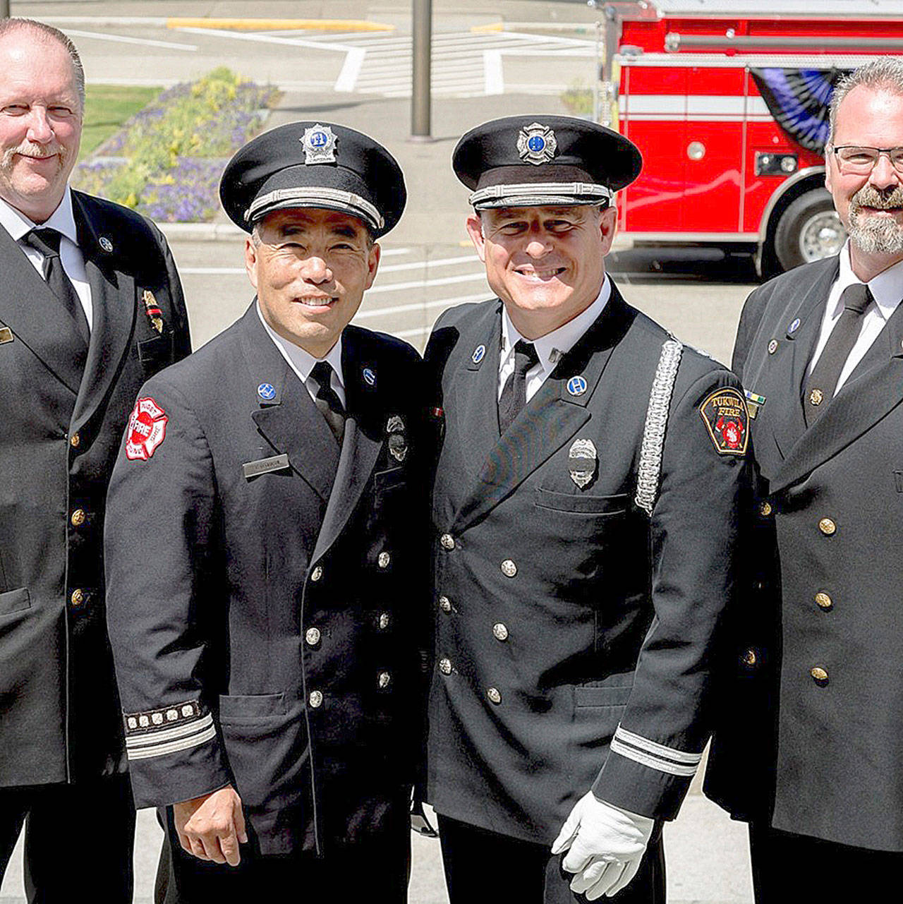 Kyle Ohashi, second from the left, will retire at the end of June after 15 years as the Puget Sound Regional Fire Authority public information officer and 30 years with the department. COURTESY PHOTO