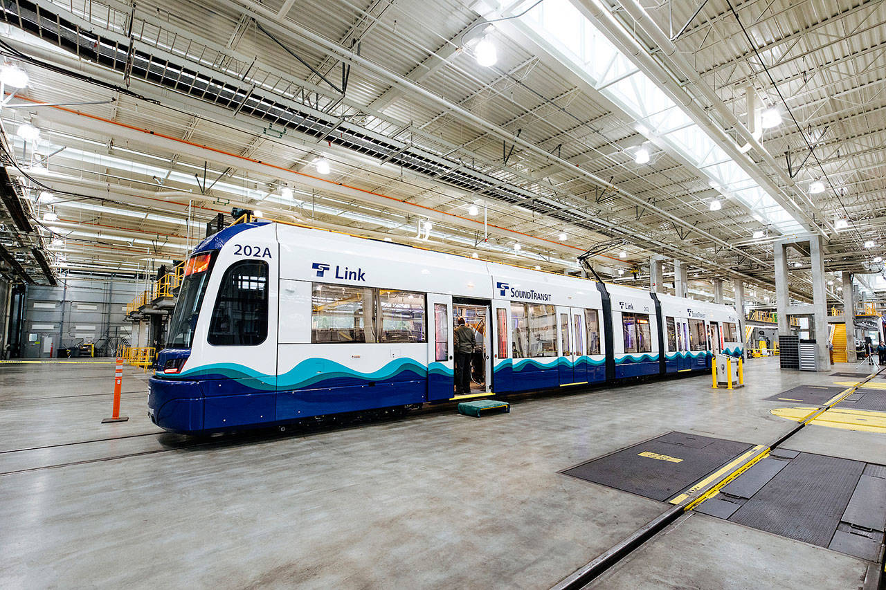 People check out one of the new light rail vehicles in June at the Operations and Maintenance Facility in Seattle. Courtesy Photo, Sound Transit