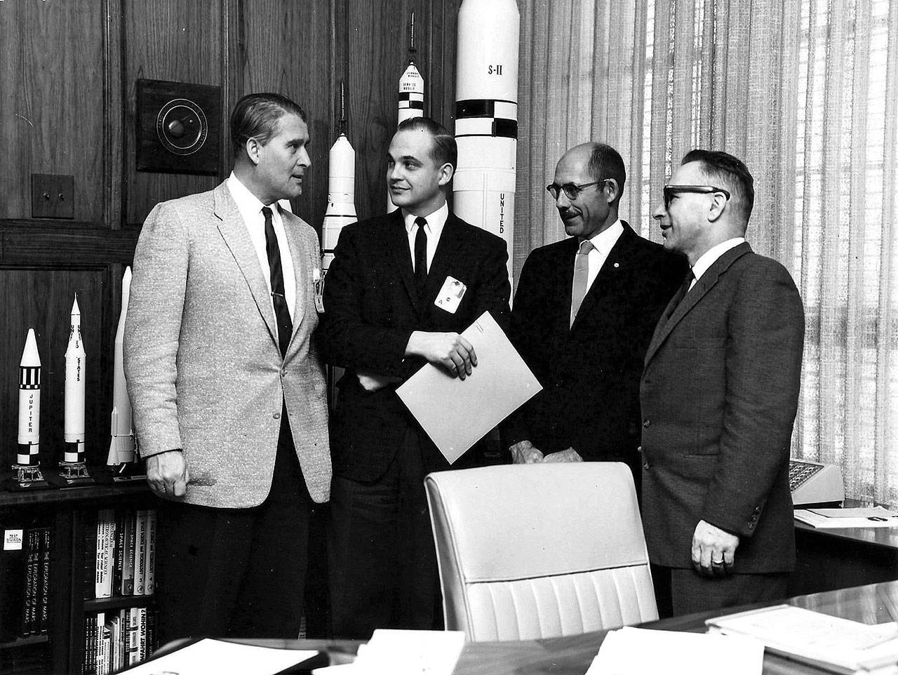 John Winch, second from left, a Boeing engineer working with NASA during the mid-1960s, receives an award from Wernher von Braun, far left, the German-born space scientist whose rocketry enabled the U.S. to make the first manned landing on the moon. Next to Winch are NASA’s Bill Miner, assistant director, and his boss, Rudolf Hoelker, far right, deputy director of the Aero Ballistics Lab in the Marshall Space Flight Center at Huntsville, Ala. COURTESY PHOTO, Winch family