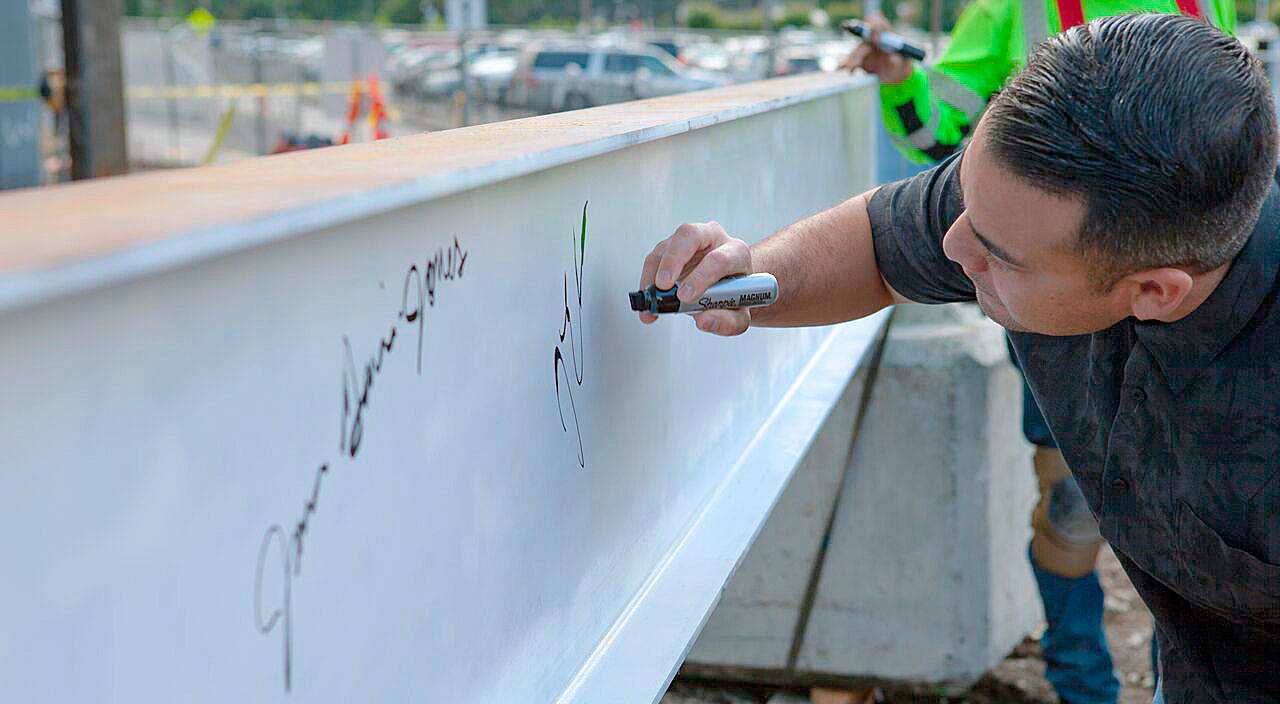 Muckleshoot Tribal Council Chair Jaison Elkins places his signature on the final structural beam for phase 1 of the casino’s expansion. COURTESY PHOTO, Muckleshoot Tribe