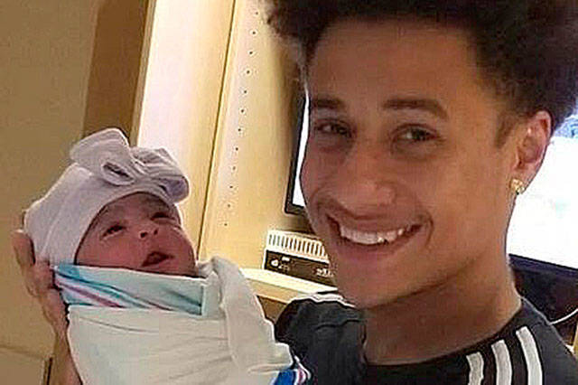 Paul Johnson with his baby daughter. COURTESY PHOTO, Johnson Family