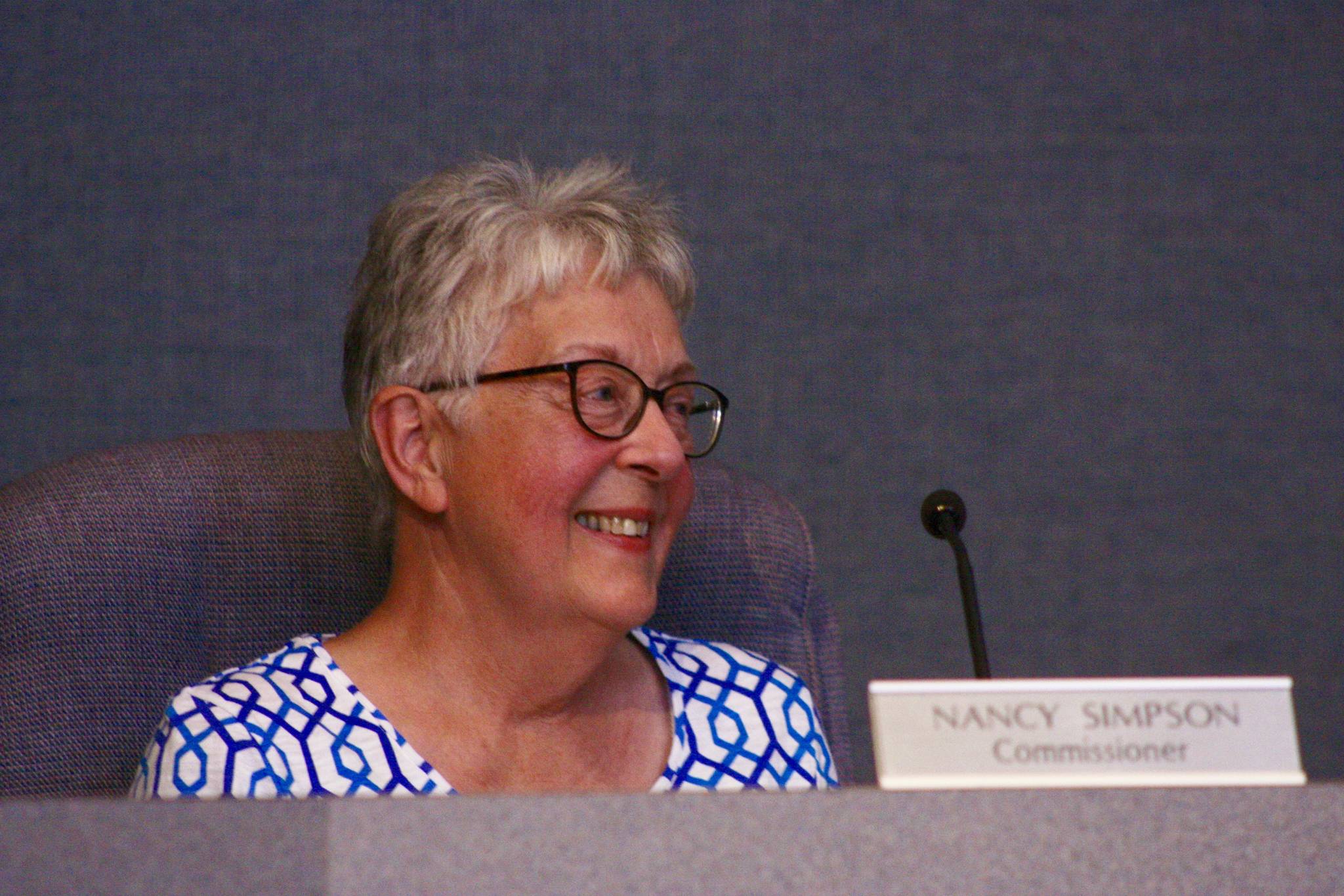 King County Landmarks Commissioner Nancy Simpson smiles after the panel granted the city of Kent historic landmark designation for three Apollo lunar rovers during a public hearing at Kent City Hall on Thursday. The rovers were manufactured at Boeing’s Space Center in Kent during the Apollo program era. MARK KLAAS, Kent Reporter