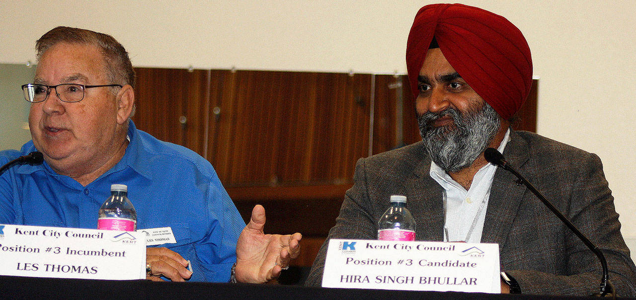 Les Thomas, left, and Hira Singh Bhullar discuss their race for the City Council during a Kent Chamber of Commerce forum Sept. 5 at Kent Commons. STEVE HUNTER, Kent Reporter