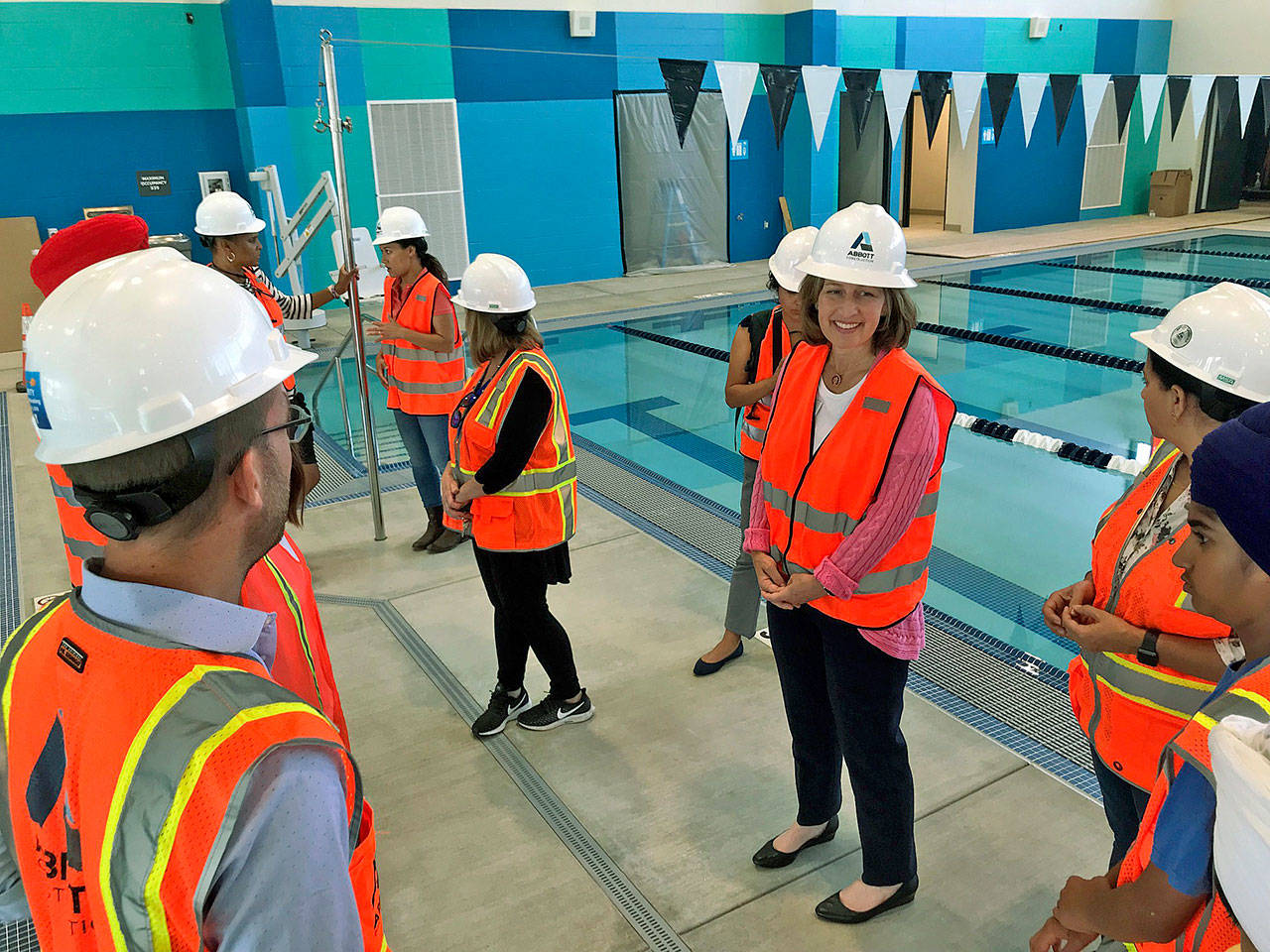 U.S. Rep. Kim Schrier, D-Issaquah, stands near the YMCA pool in Kent during a recent tour. MARK KLAAS, Kent Reporter