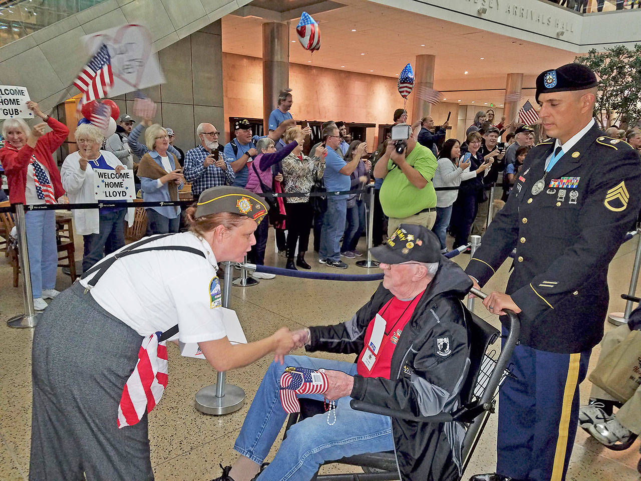 Military veterans recently were welcomed home from their Honor Flight. COURTESY PHOTO, Walt Tanimoto