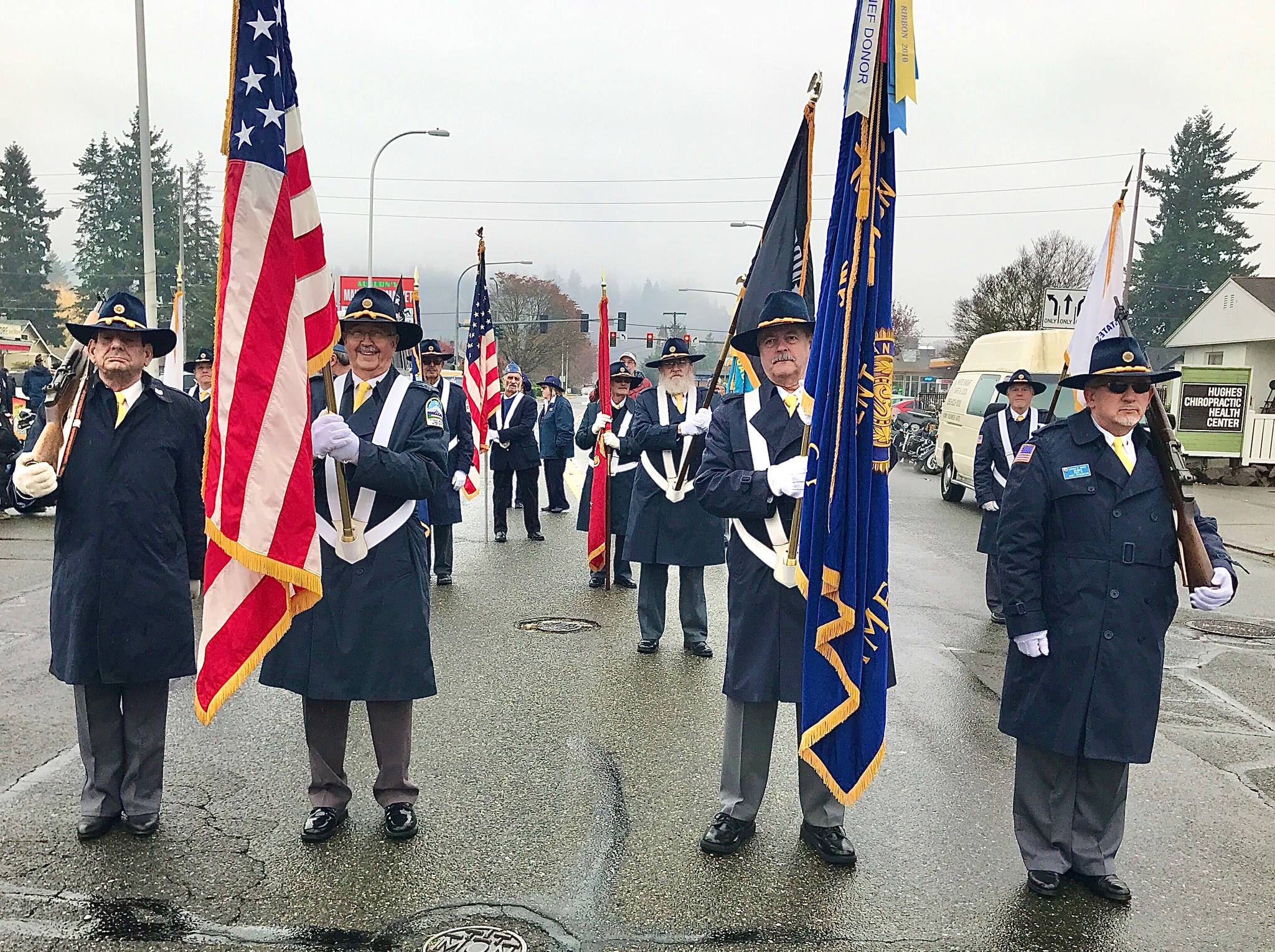 Legionnaires of Post 15 of the American Legion’s Color/Honor Guard prepare to represent the city of Kent at the 54th annual Auburn Veterans Parade on Saturday. Don Whittington, commander of Post 15, led the Legionnaires Color/Honor Guard. COURTESY PHOTO, Chriss Moen
