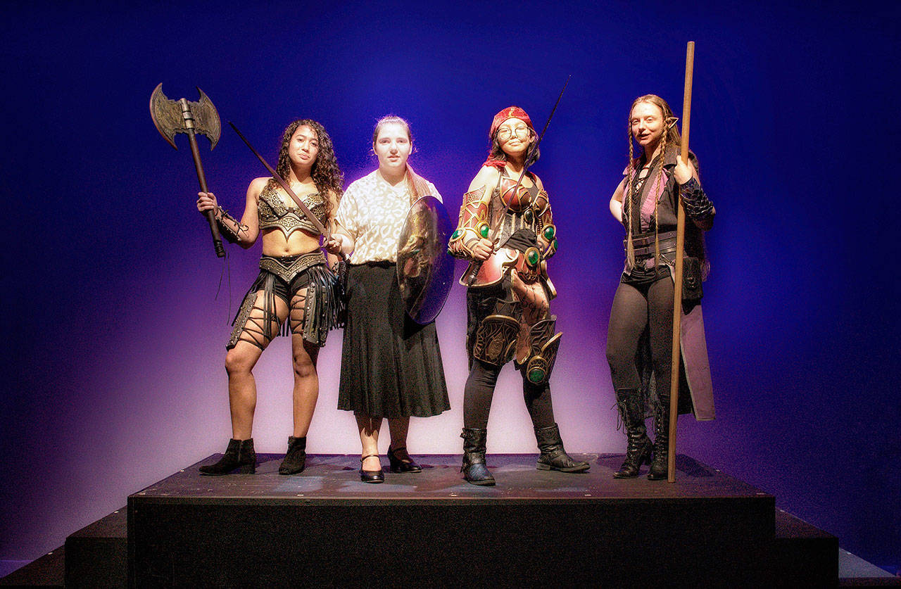 From left to right, Amber Marcotte (Lilith, The Demon Queen), McCaulley Smith (Agnes), Malia Silvia (Tillius The Paladin) and Fiona Gordon (Kaliope, The Dark Elf), act in the Kent-Meridian High production of “She Kills Monsters.” COURTESY PHOTO, Kent-Meridian Drama