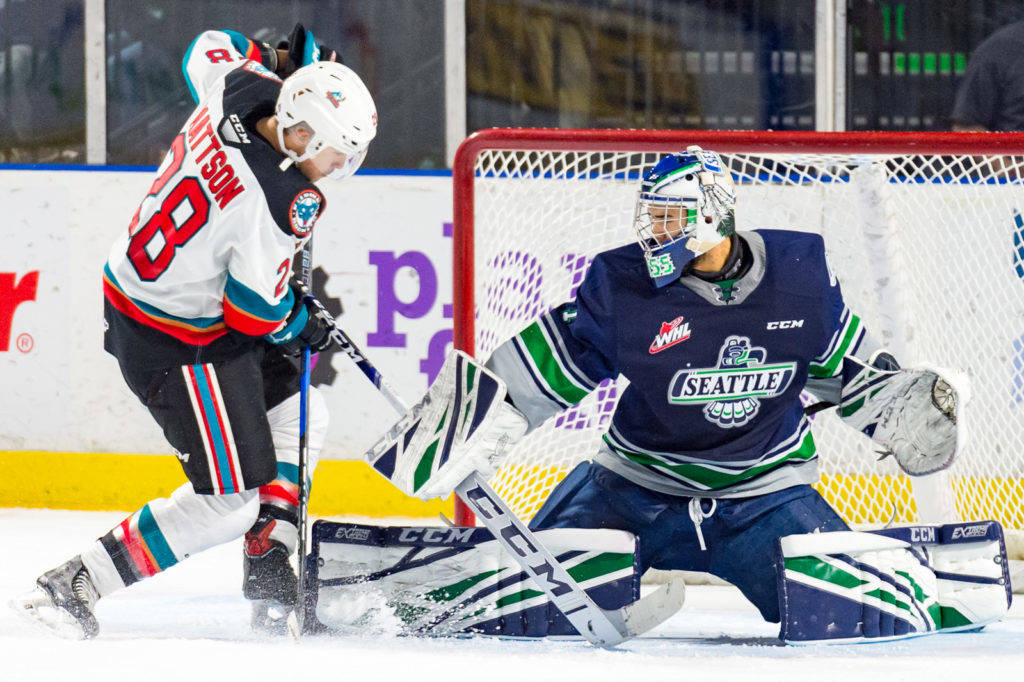 Rockets right wing Leif Mattson attempts to push the puck past Thunderbirds goalie Roddy Ross during WHL play Friday night. COURTESY PHOTO, Brian Liesse, T-Birds