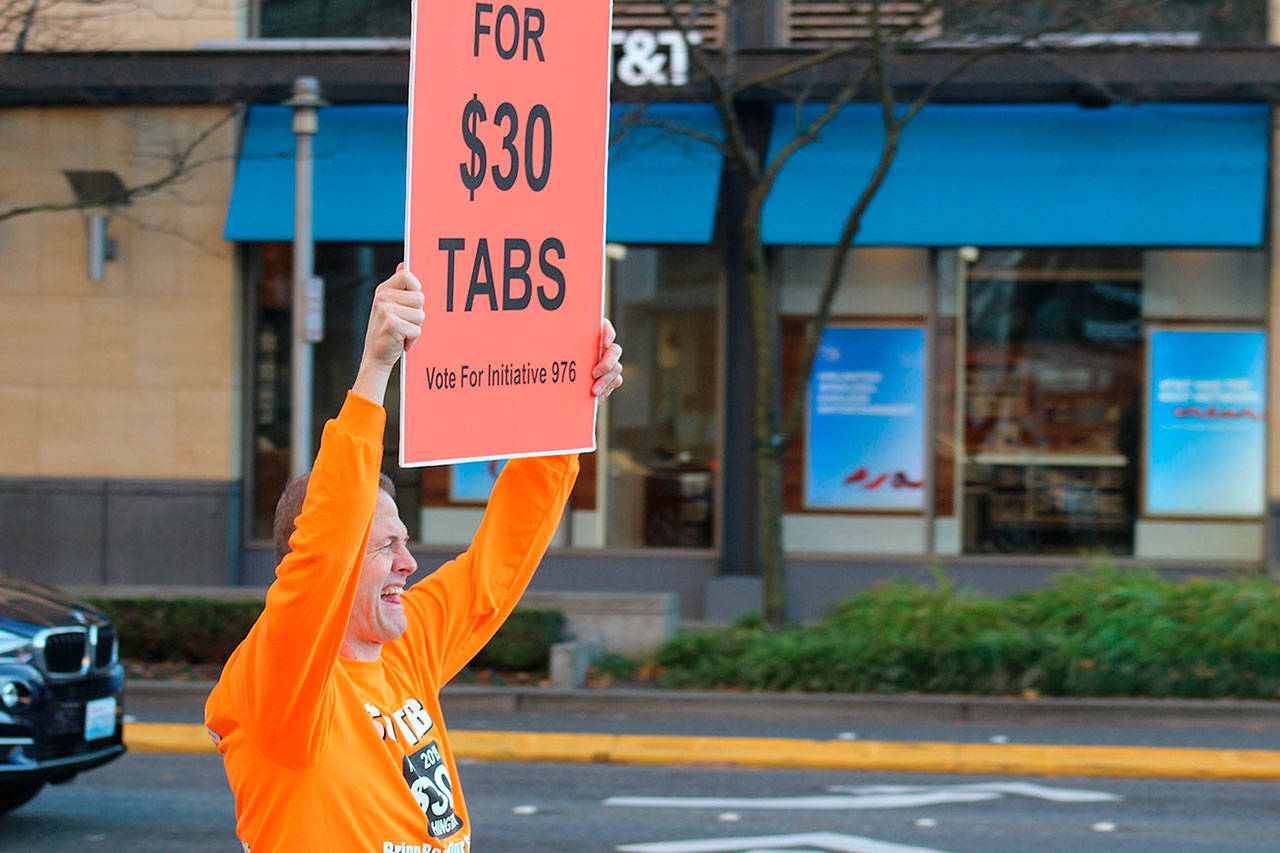 Tim Eyman campaigns for I-976 in downtown Bellevue on the afternoon of Nov. 5. Voters passed the initiative, setting car tabs at $30 statewide with opponents warning it would bankrupt transit projects throughout the state. FILE PHOTO, Aaron Kunkler