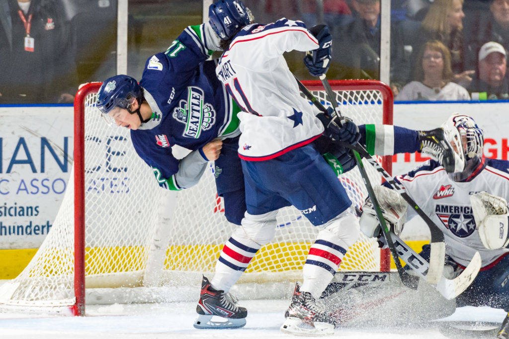 The Americans’ Samuel Stewart upends Thunderbirds center Henrik Rybinski in front of the crease during WHL action Friday night. COURTESY PHOTO, Brian Liesse, T-Birds