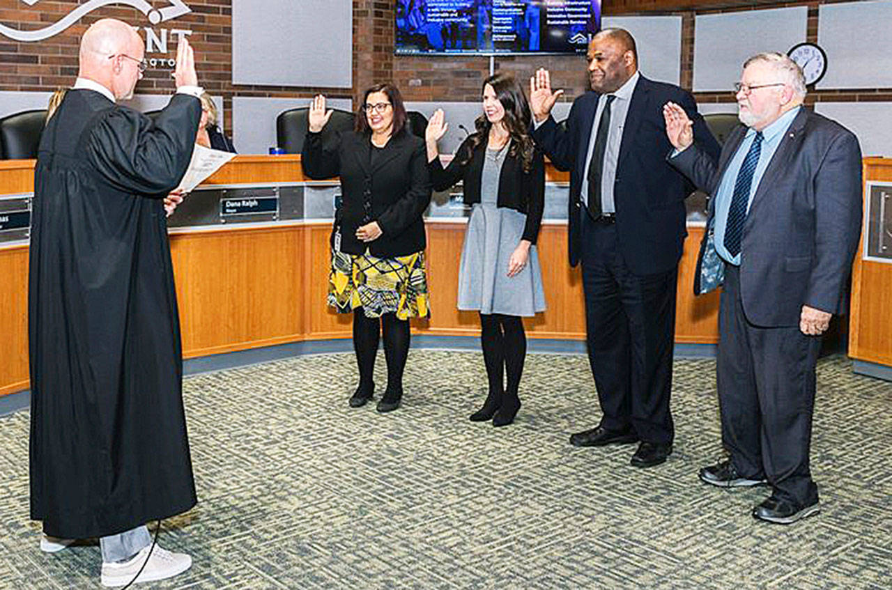 Kent Municipal Court Judge Michael Frans swears in City Council members, from left to right, Marli Larimer, Zandria Michaud, Bill Boyce and Les Thomas on Tuesday, Jan. 7, at City Hall. COURTESY PHOTO, City of Kent