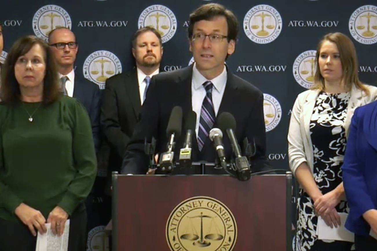 Washington State Attorney General Bob Ferguson (center) announced a lawsuit against Johnson & Johnson in a press conference Jan. 2. Debbie Warfield of Everett (left) lost her son to a heroin overdose in 2012. Skagit County Commissioner Lisa Janicki (right) lost her son to an overdose of OxyContin in 2017. They are joined by Rep. Lauren Davis of Shoreline (second from right), founder of the Washington Recovery Alliance. (TVW screenshot)