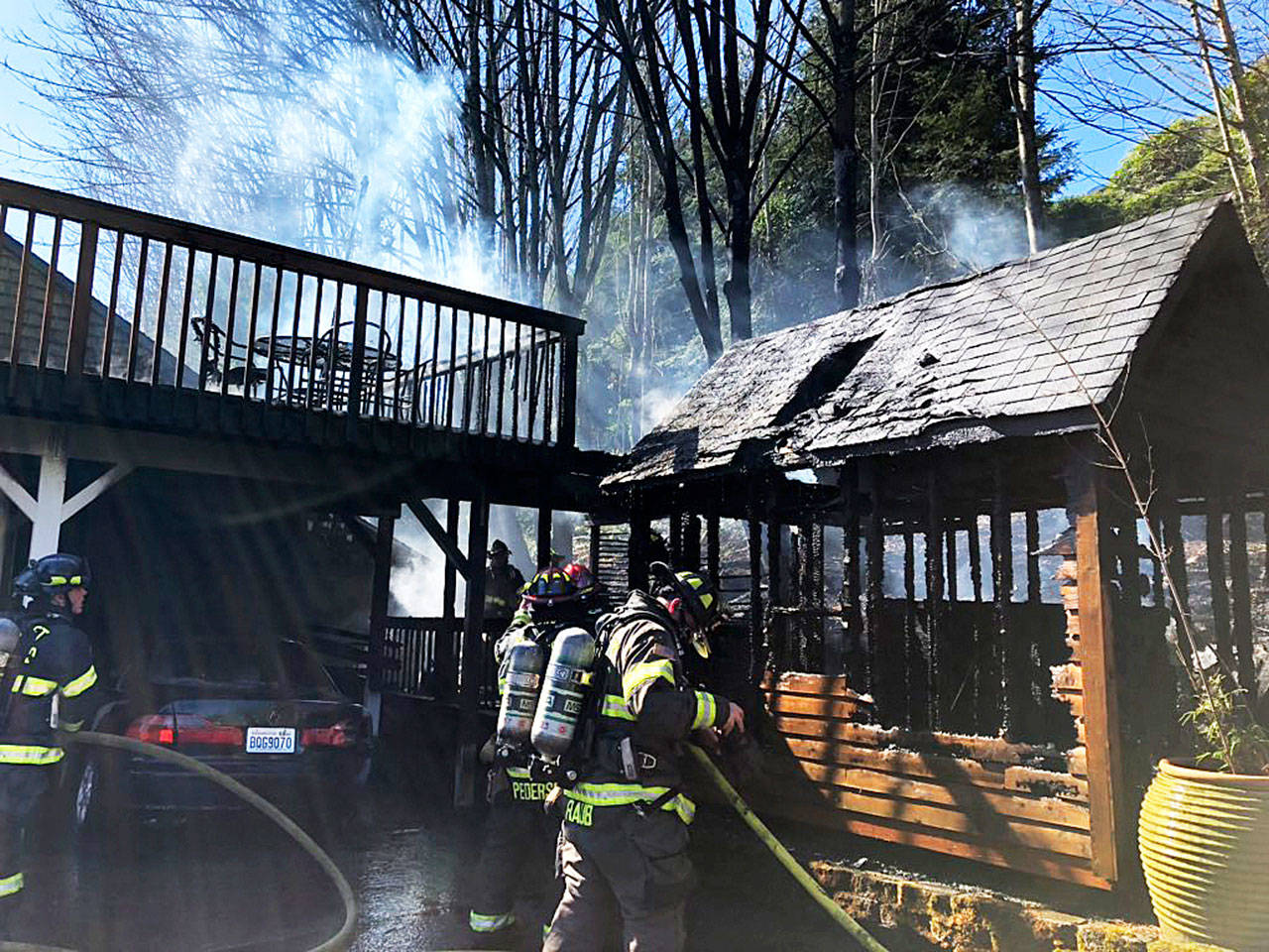 Firefighters put out a fire Monday afternoon at a shed and house deck in the 25200 block of Reith Road in Kent. COURTESY PHOTO, Puget Sound Fire