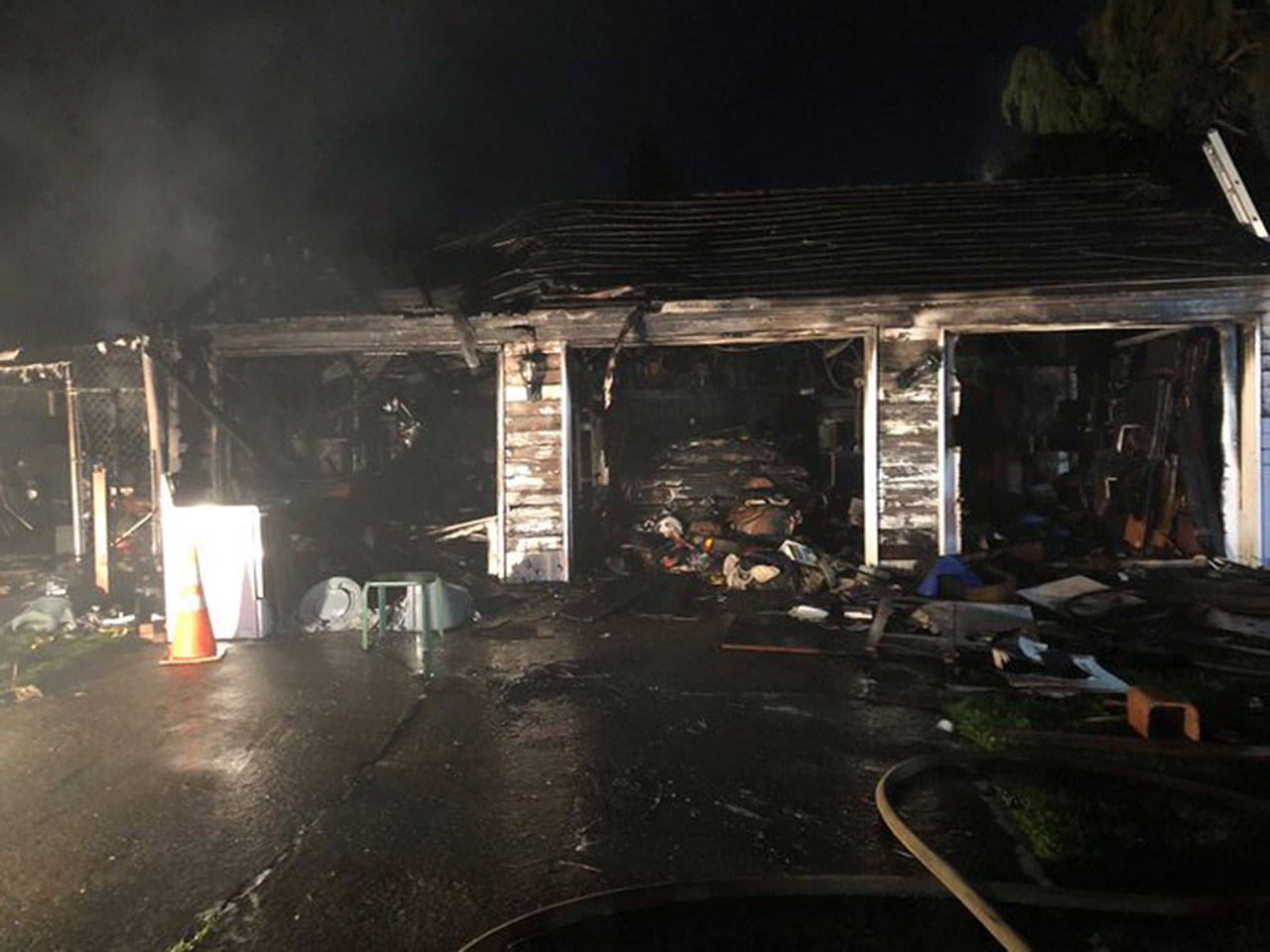 A three-car garage burned Wednesday night in the 400 block of Prospect Avenue North in Kent. COURTESY PHOTO, Puget Sound Fire