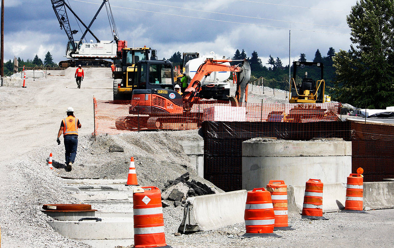 Crews head up the South 228th Street overpass under construction on Monday. The project, when finished in early 2021, will allow vehicles to go over the Union Pacific Railroad tracks. STEVE HUNTER, Kent Reporter