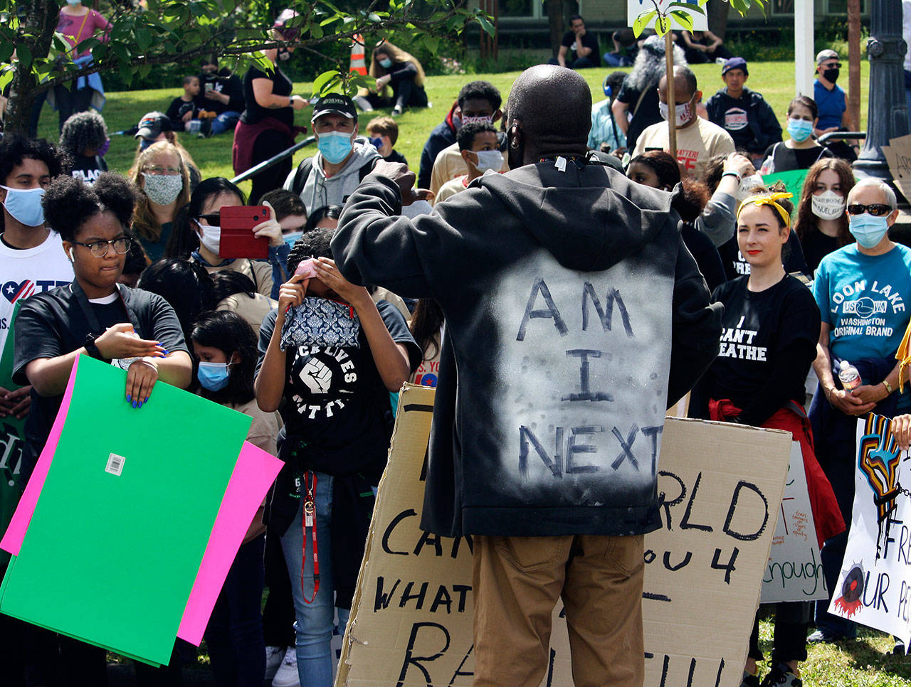 A man speaks to the crowd June 11 outside of the Maleng Regional Justice Center in Kent. STEVE HUNTER, Kent Reporter