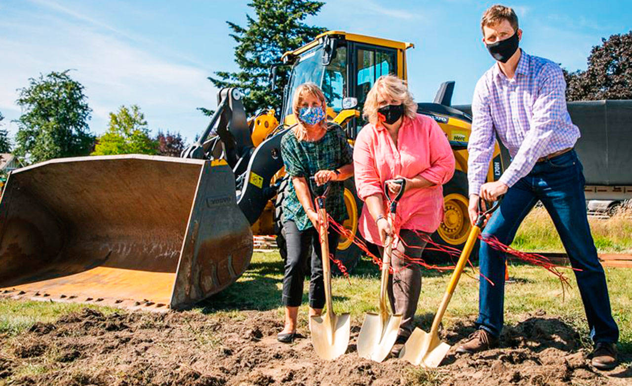 Kent City Council President Toni Troutner, Mayor Dana Ralph and Deputy Public Works Director Chad Bieren help kick off construction of the new roundabout at Fourth Avenue South and Willis Street. COURTESY PHOTO, City of Kent