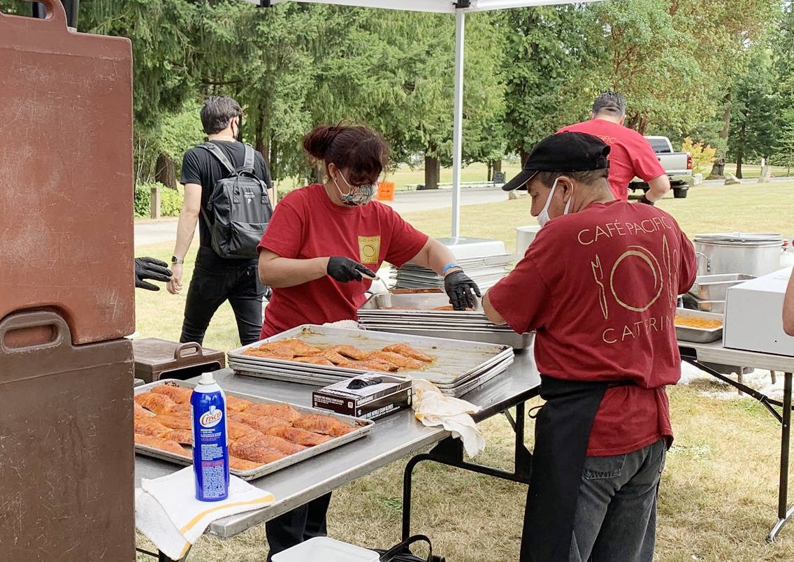 When the Federal Way Kiwanis wanted to safely continue their 64th annual Salmon Bake fundraiser, John and Amy Hatcher from Café Pacific Catering had the answer: A succulent salmon dinner, prepared and served following all safe food service guidelines, and picked up curbside by appreciative diners and supporters!