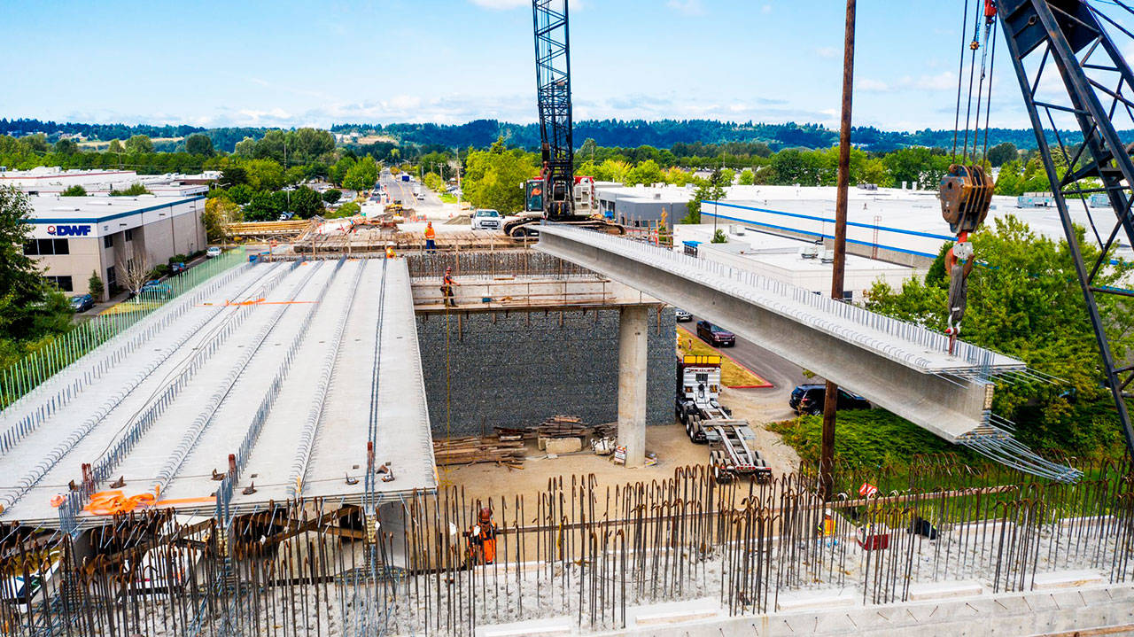Crews place bridge girders on Aug. 3 for the South 228th Street overpass that will span the Union Pacific Railroad tracks and Interurban Trail. COURTESY PHOTO, Alex Klinger, City of Kent Public Works, via drone