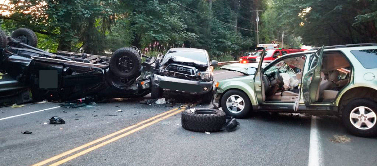 Jaime Alonso Gomez, 50, of Kent, was killed Aug. 4 in a head-on collision in the 29500 block of Kent Black Diamond Road Southeast after the Ford F-350 (left) crossed into the oncoming lane, collided with the Ford Escape (right), flipped and hit the Toyota Tacoma (center). Gomez was a right front passenger in the Ford Escape. COURTESY PHOTO, King County Sheriff’s Office