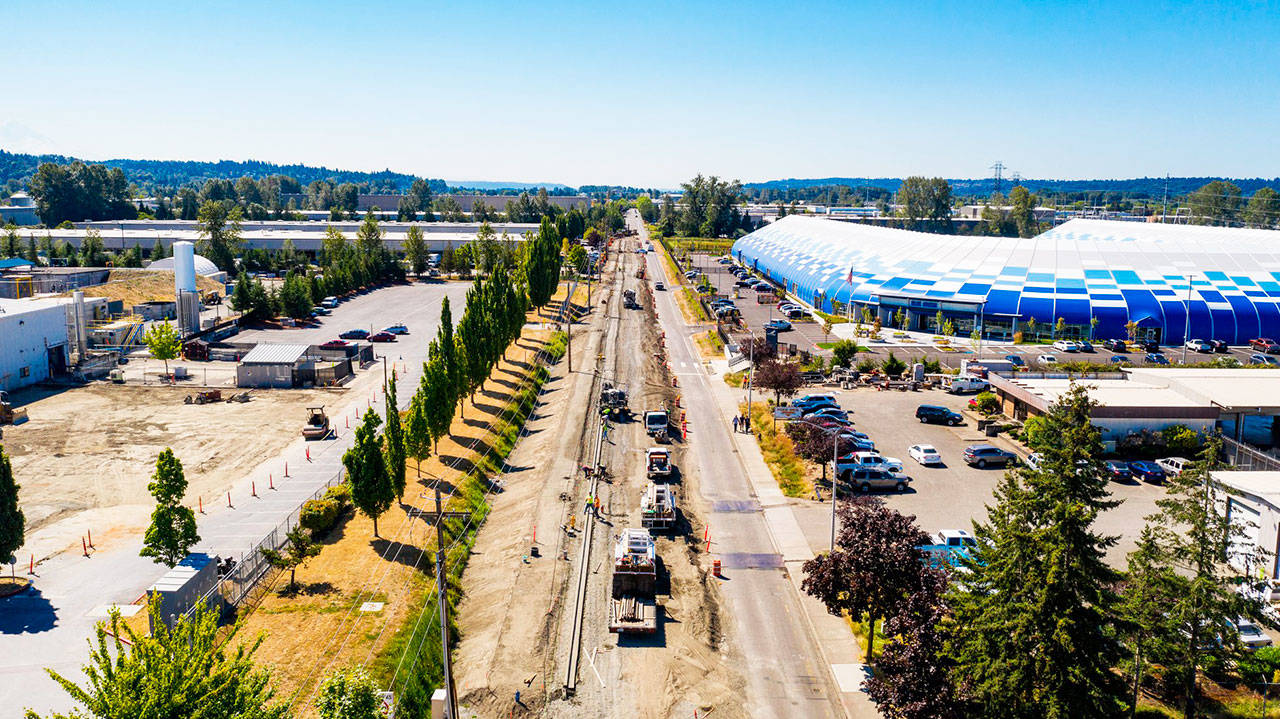 Crews work to raise 76th Avenue South by about 3 feet between South 212th Street and South 228th Street in Kent to stop the annual flooding problem along the road. Blue Origins headquarters is on the right. COURTESY PHOTO, City of Kent Public Works
