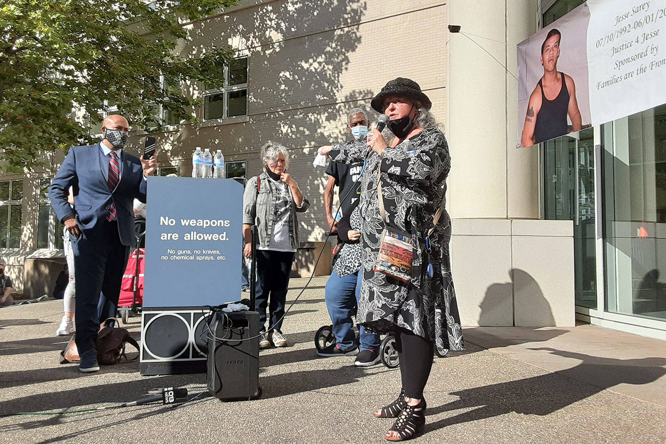 Elaine Simons, former foster mother of Jesse Sarey, addresses a crowd outside the Maleng Regional Justice Center Monday morning, Aug. 24, moments after Auburn Police Officer Jeff Nelson was formally charged with second-degree murder and first-degree assault in the May 31, 2019 shooting death of 26-year-old Sarey in front of a north Auburn convenience store. ROBERT WHALE/Auburn Reporter