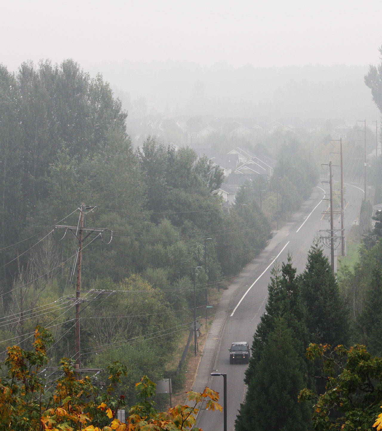 Smoke fills the Kent Valley on Monday, Sept. 14 looking east toward South 216th Street from the Robert Morris Earthwork public art installation on the west hill in SeaTac. STEVE HUNTER, Kent Reporter