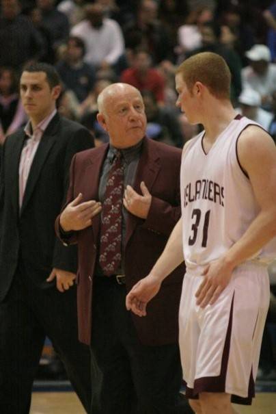 Ed Pepple speaks with Islander Evan Zahniser in 2008 at halftime of a district playoff game while assistant Gavin Cree stands in the background. The team finished 22-5 that season and was 16-0 in Kingco. Photo courtesy of the Mercer Island School District