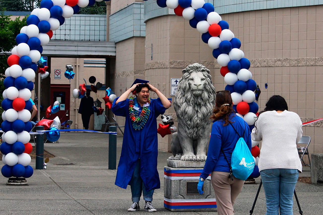 A Kent-Meridian High School graduate makes the walk at the 2020 ceremony. FILE PHOTO, Kent Reporter