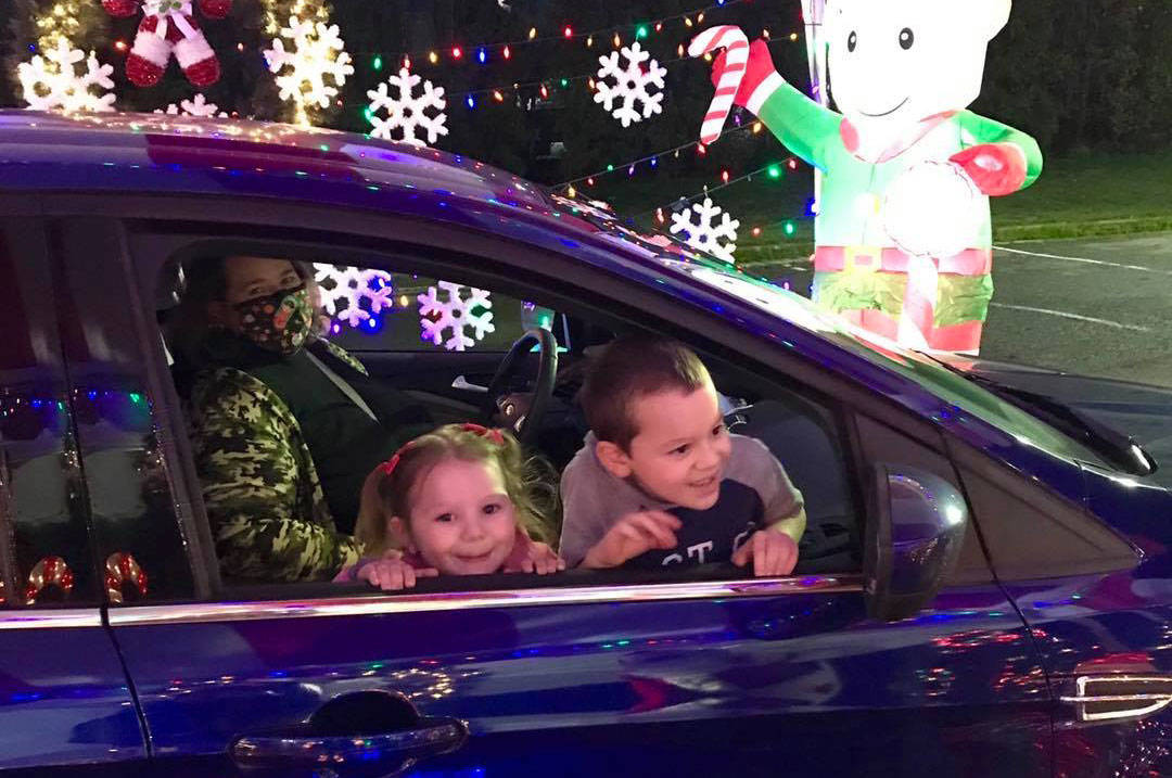 Two children check out Candy Cane Lane drive-thru event that was open Saturday, Dec. 12, at Hogan Park and outside the Kent Valley Ice Centre. COURTESY PHOTO, City of Kent