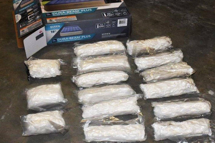 Bags of meth seized by law enforcement agencies that were concealed in a mattress box. COURTESY PHOTO, DEA