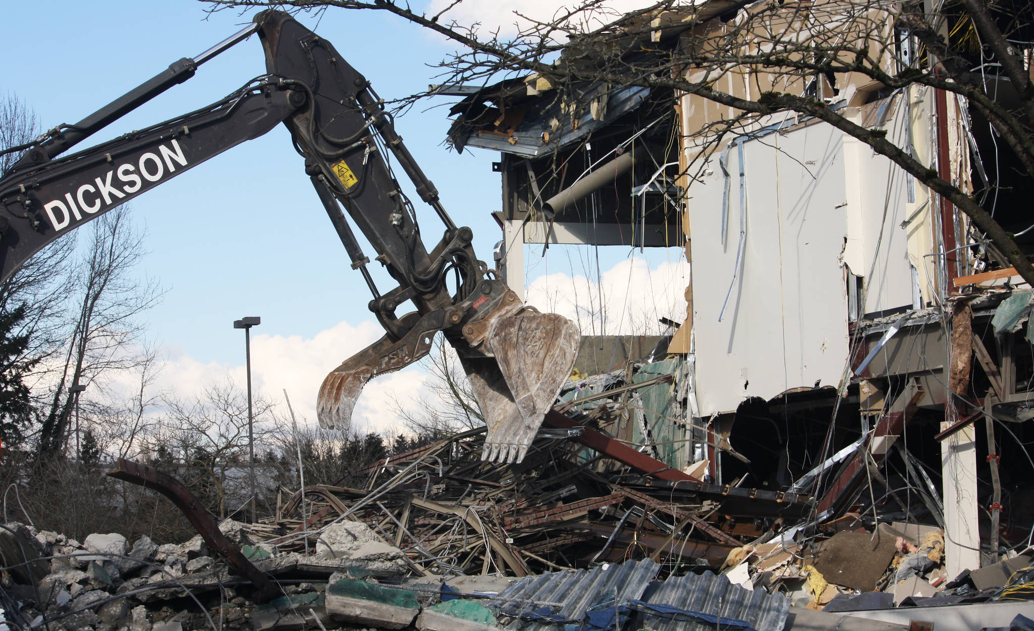 Crews began this week demolishing the former REI headquarters in Kent, 6750 S. 228th St. Two warehouses will replace the former office buildings. STEVE HUNTER, Kent Reporter